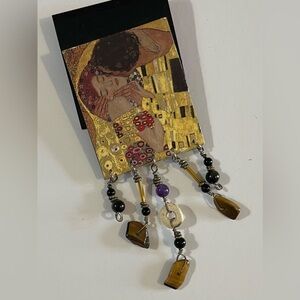 Artistic Beaded Pendant with Gold and Black Accents